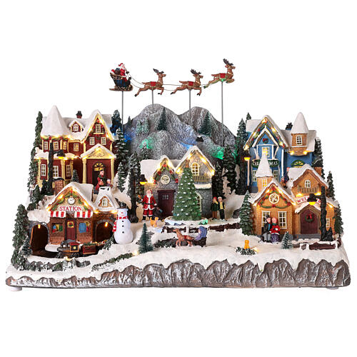 pueblo navideno papa noel en trineo y renos 40x60x30 cm